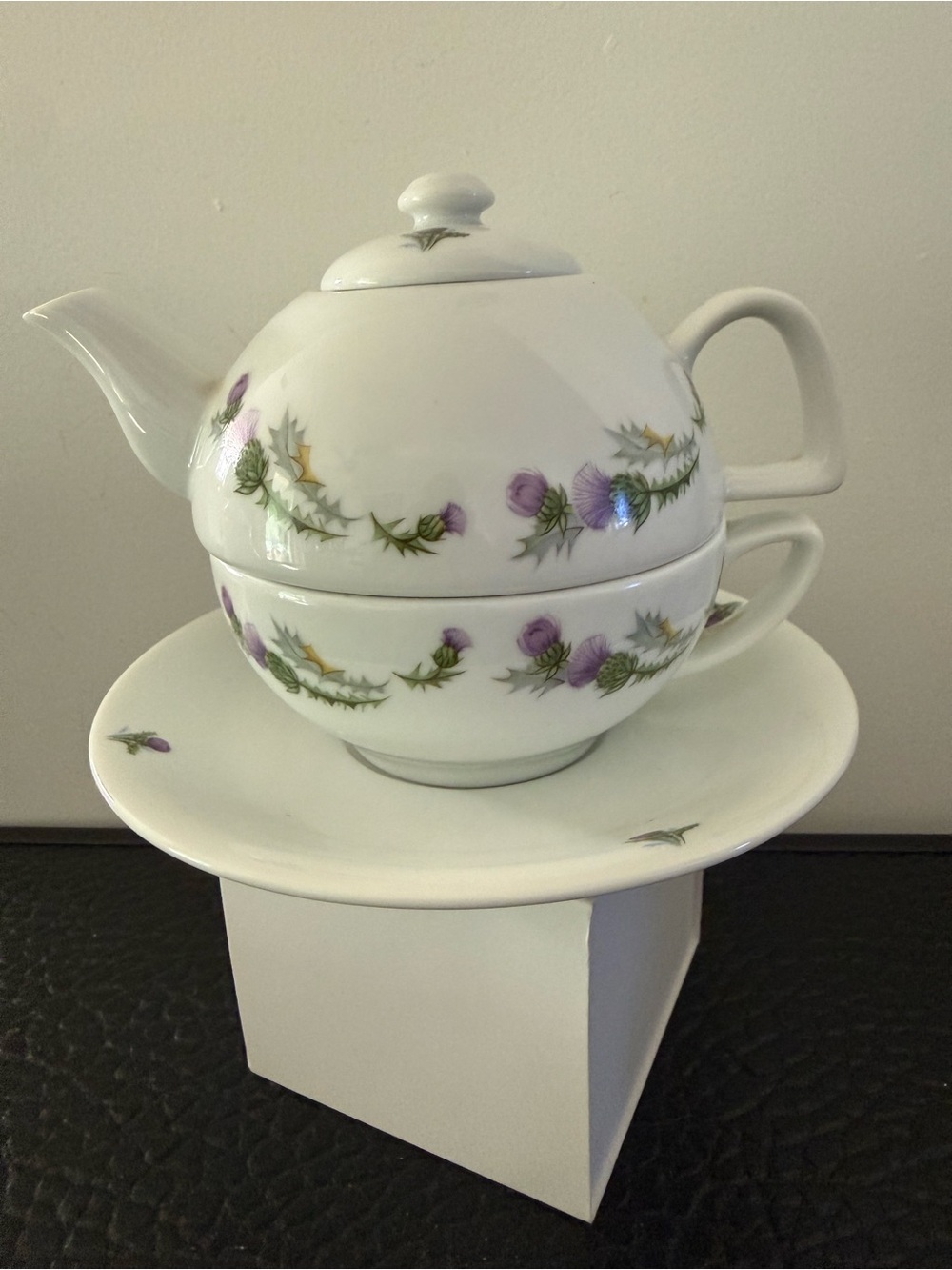 "Tea for Oneset, made of porcelain pattern of purpleflowers and green leaves